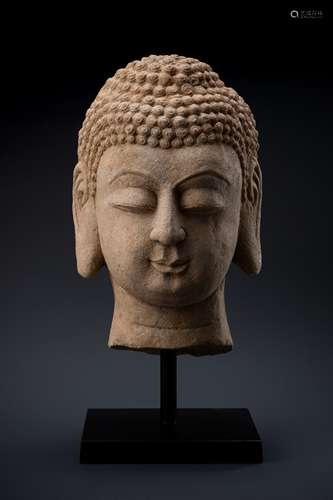 A MASSIVE STONE HEAD OF BUDDHA