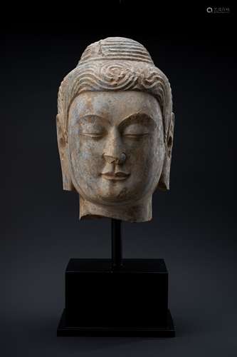 A MASSIVE GREY STONE HEAD OF BUDDHA