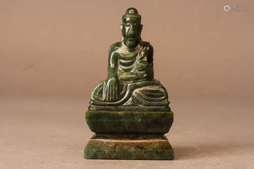 A JADEITE FIGURE OF SEATED GUANYIN