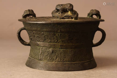 A DUMP-SHAPED BRONZE DISPLAY