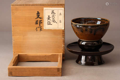 A JIAN BROWN-GLAZED TEA BOWL WITH STAND