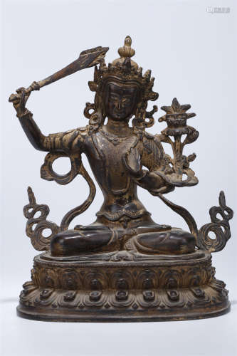 A Powdered Gilt Copper Manjusri Statue.