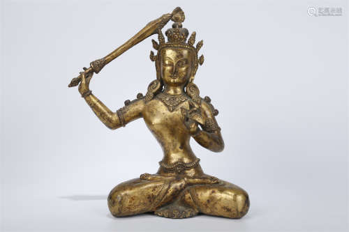 A Gilt Copper Manjusri Bodhisattva Statue.
