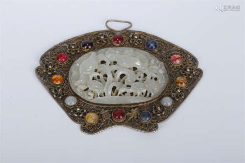 A Gilt Copper Pendant with Hetian Jade Inlay.