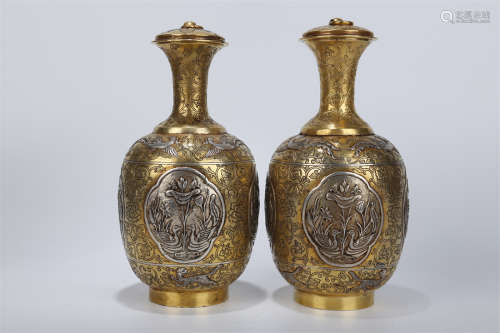 A Pair of Gilt Copper Lidded Bottles.