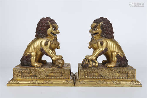 A Set of Gilt Copper Lion Sculptures.