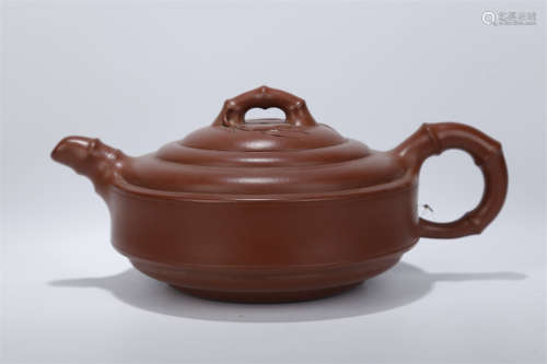 A Purple Clay Teapot with 