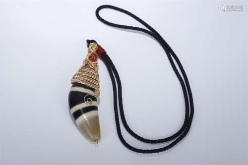A Horn Shaped Dzi Bead Necklace.