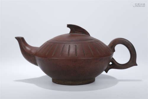 A Magic Lamp Shaped Purple Clay Teapot.