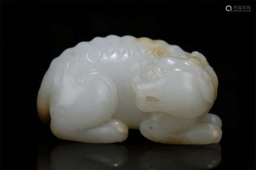 A Hetian Jade Auspicious Beast Sculpture.