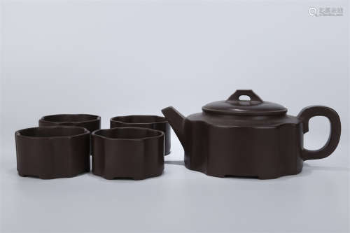 A Set of Purple Clay Teapot and Teacups.