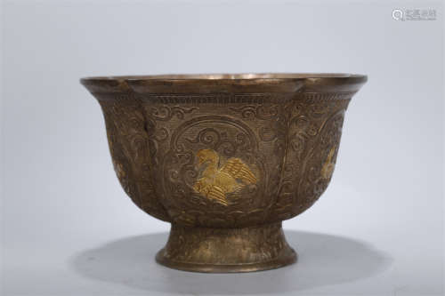 A Copper Bowl with Ducks Design.