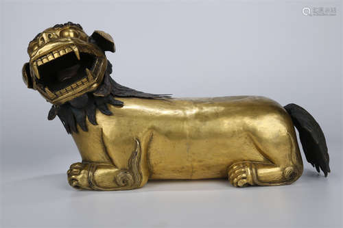 A Gilt Copper Snow Mountain Lion Sculpture.