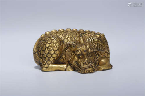 A Gilt Copper Auspicious Beast Sculpture.