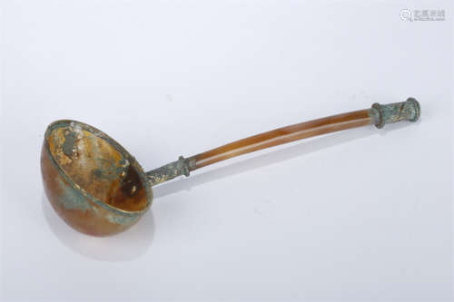 An Agate Spoon with Golden Rim.