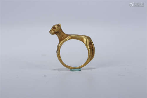 A Gilt Copper Beast-Knob Ring.