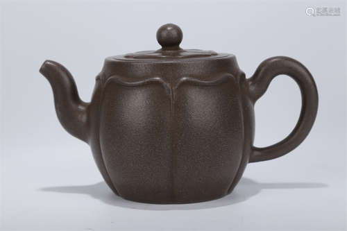 A Petal Shaped Purple Clay Teapot.