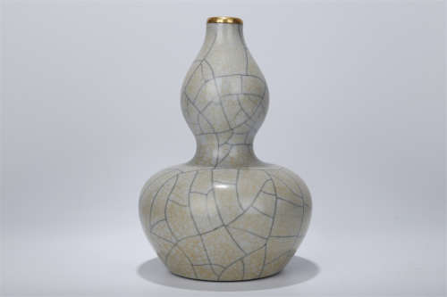 A Gourd Shaped Porcelain Bottle.