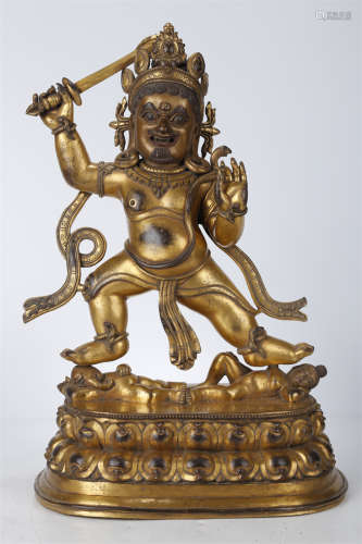 A Gilt Copper Acalanatha Buddha Statue.