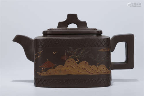 A Purple Clay Teapot with Landscape Design.