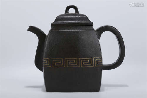 A Purple Clay Teapot.