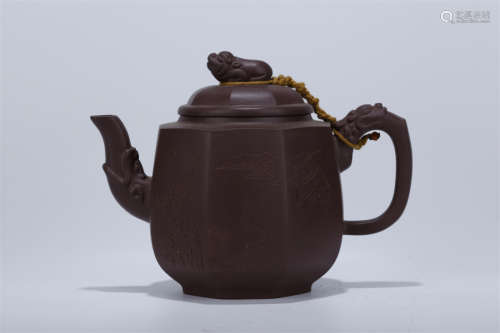 An Eight-Arris Purple Clay Teapot.