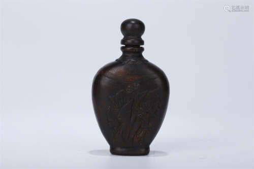 An Agarwood Snuff Bottle with Flowers Design.