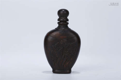 An Agarwood Snuff Bottle with Flowers Design.