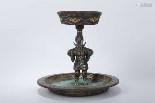 A Bronze Candlestick.