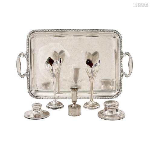 A silver tray and five silver candle holder