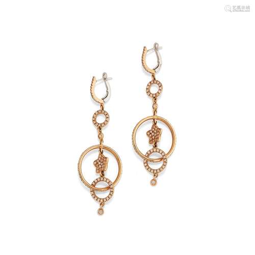 A two color gold and diamond earrings