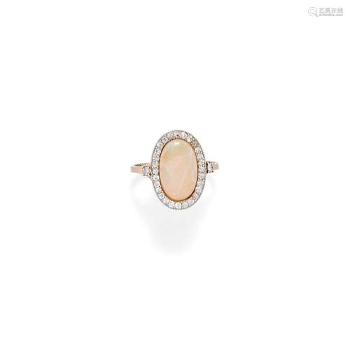 A 18K two-color gold, opal and diamond ring