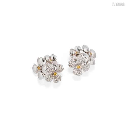 A 18K white gold, diamond and yellow sapphire earrings