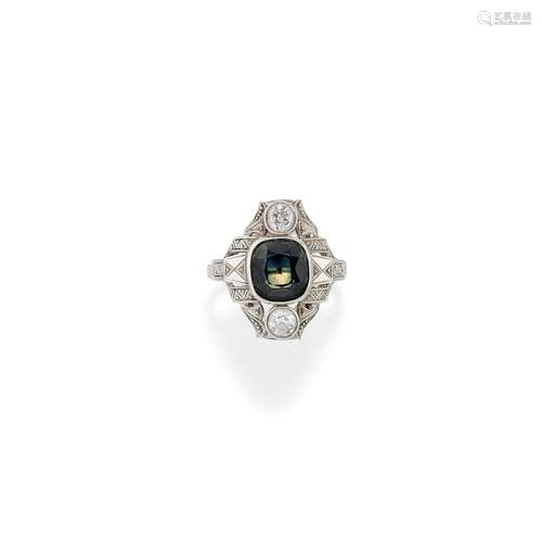 A 18K white gold, diamond and synthetic green gemstone ring