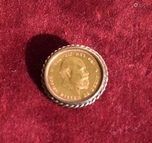 Een gouden tientje Willem III, broche bruto 10.2 gr