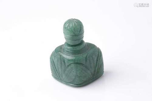 An Eastern carved variegated green hardstone scent bottle of...