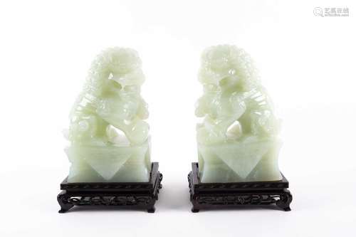 A pair of Chinese carved pale green Jadeite figures of "...