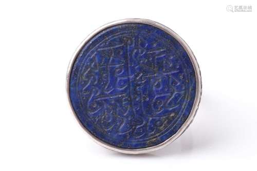 A probably Persian white metal dress ring set with a circula...