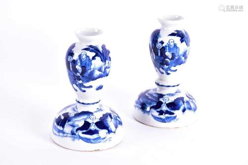 A pair of Chinese blue & white baluster form candlestick...