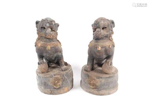 A pair of Chinese carved wood temple lions, Qing, each carve...