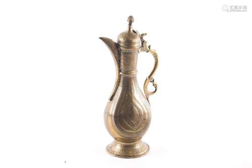 A Persian (Bokhara) brass coffee pot, Qajar Dynasty, With hi...