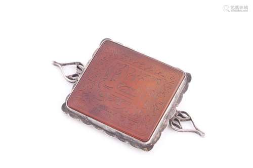 An Indo Persian hardstone pendant in silver metal mount, eng...