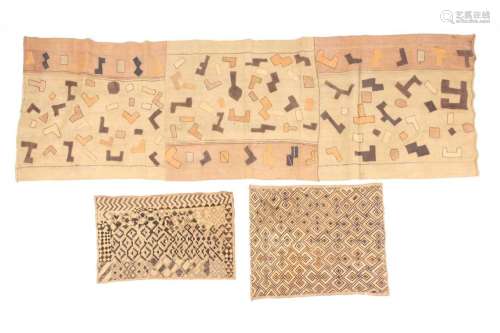 An African Kuba textile panel and other African textiles. 63...