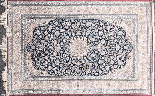 A 20th-century Indigo blue ground Kashan carpet, with centra...