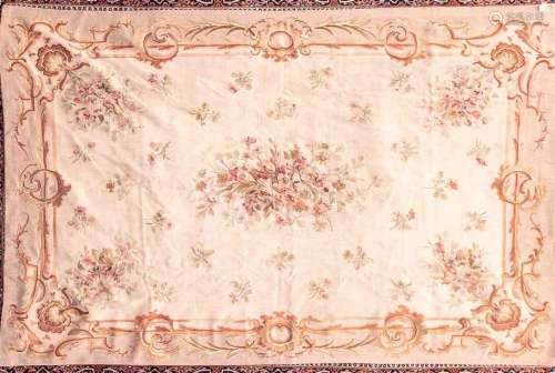 A 20th century ivory ground Aubusson style tapestry carpet w...