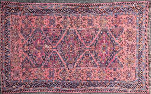 A 20th-century red ground Caucasian Soumak carpet with large...