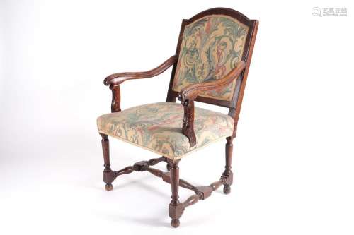 A French Regency style walnut open armchair, 19th century, w...