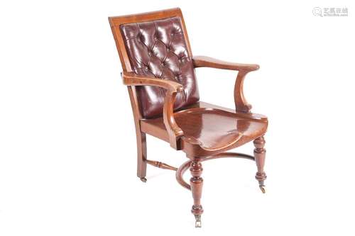 A late Victorian mahogany desk chair with moulded seat and l...