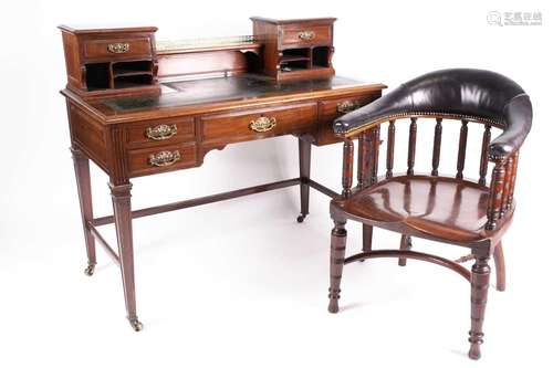 An Edwardian mahogany Bonheur du Jour with small drawers and...