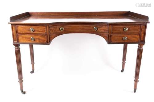 A George III Gillows of Lancaster mahogany kneehole library/...